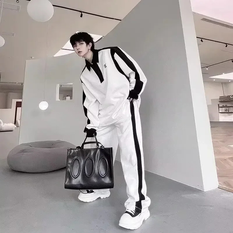 High end black and white splicing contrasting color sports long sleeved set twopiece pants casual mens wear 250319