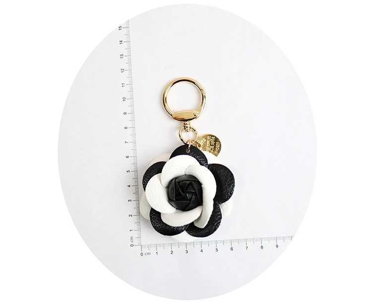 Cute synthetic PU leather rose camellia keychain suitable for women tripod keychain circular car bag pendant charm D467XJ250319