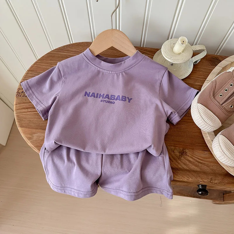 Summer baby girl sportswear set solid color letter printed Tshirtshorts 2PCS suitable for 210 year old boys casual wear 250319