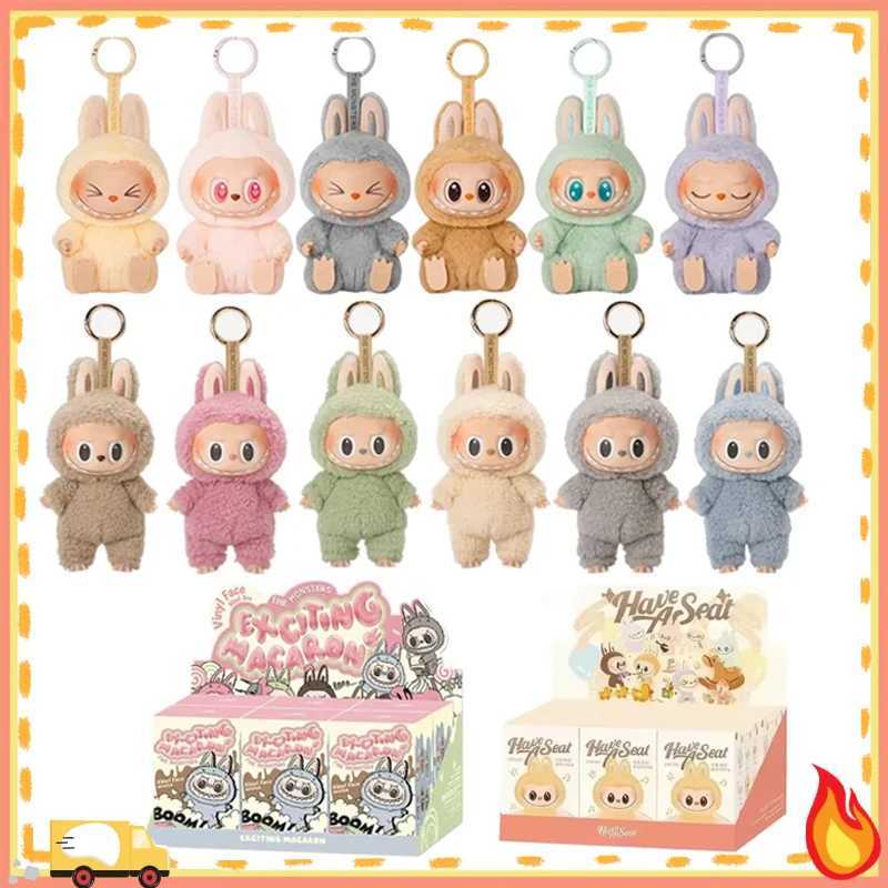 1 1. High quality Kawaii Monster Labubu Blind Box Series PVC Labubu Macaron Pendant Doll Monster Keychain Birthday Holiday Childrens GiftXJ250319