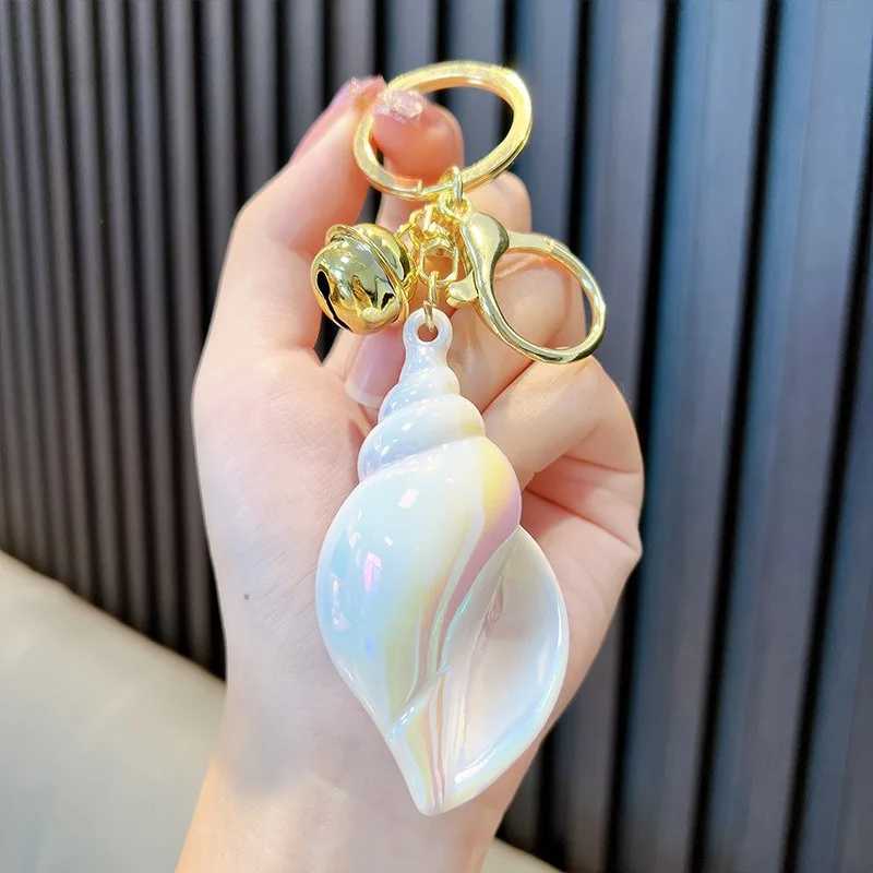 Electroplated colored Conch keychain suitable for women cute car keychain used for wallets backpacks bags charms acrylic keychains with lobster claspX