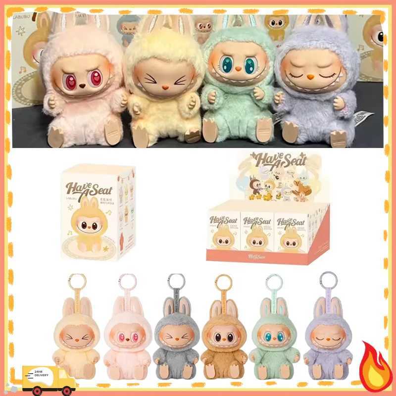 1 1. High quality Kawaii Monster Labubu Blind Box Series PVC Labubu Macaron Pendant Doll Monster Keychain Birthday Holiday Childrens GiftXJ250319