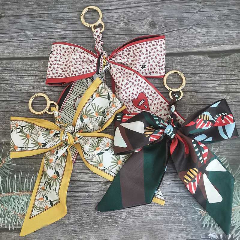 New Womens Soft Silk Scarf Keychain Womens Bag Ribbon Bow Pendant Fashion Car Keyring Bracket Charm Gift AccessoriesXJ250319