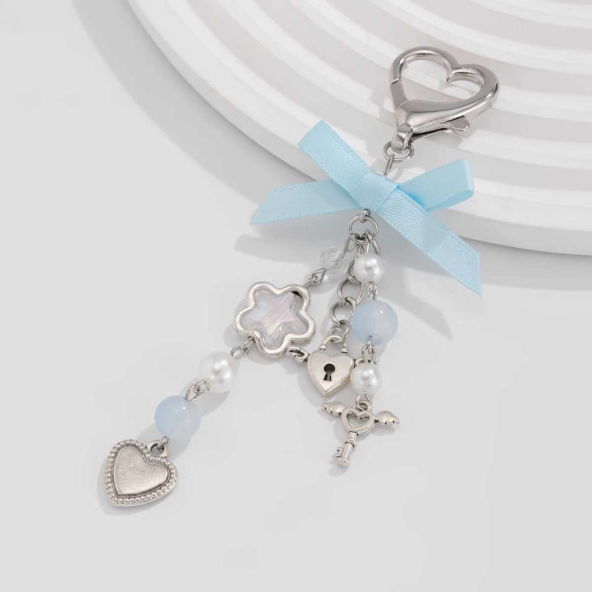 IngeSight. Z Sweet and Cute Blue Bow Star Charm Keychain Womens Fashion Imitation Pearl Love Pendant Keychain JewelryXJ250319