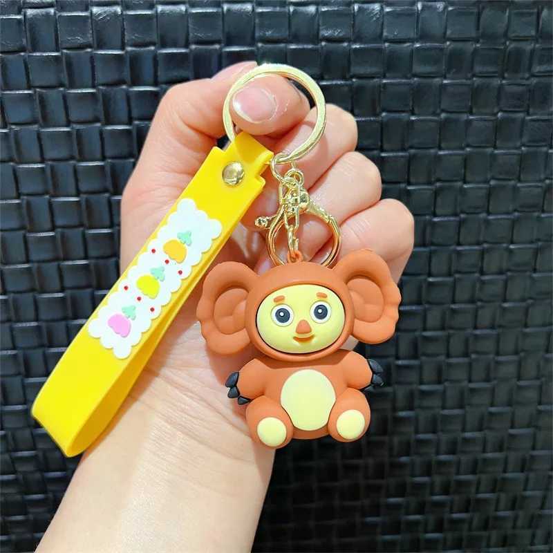 Cheburashkas monkey keychain cartoon animal doll car keychain backpack pendant decoration childrens education Christmas giftXJ250319