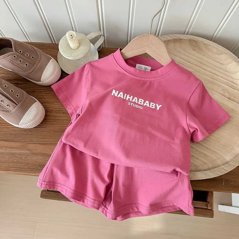 Summer baby girl sportswear set solid color letter printed Tshirtshorts 2PCS suitable for 210 year old boys casual wear 250319