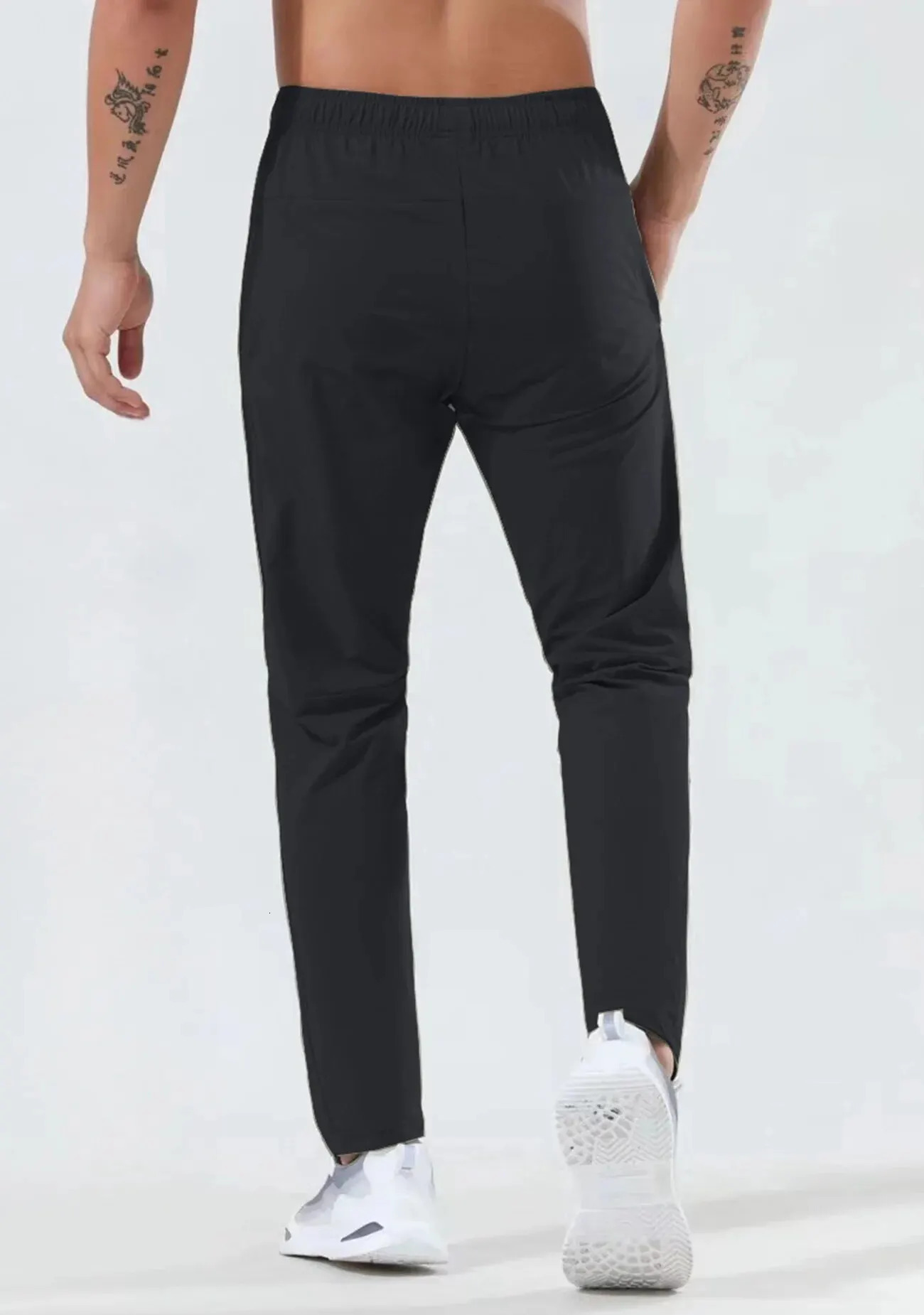 Mens fast drying breathable waist dragging and jogging pants fashionable high elasticity sports 250320