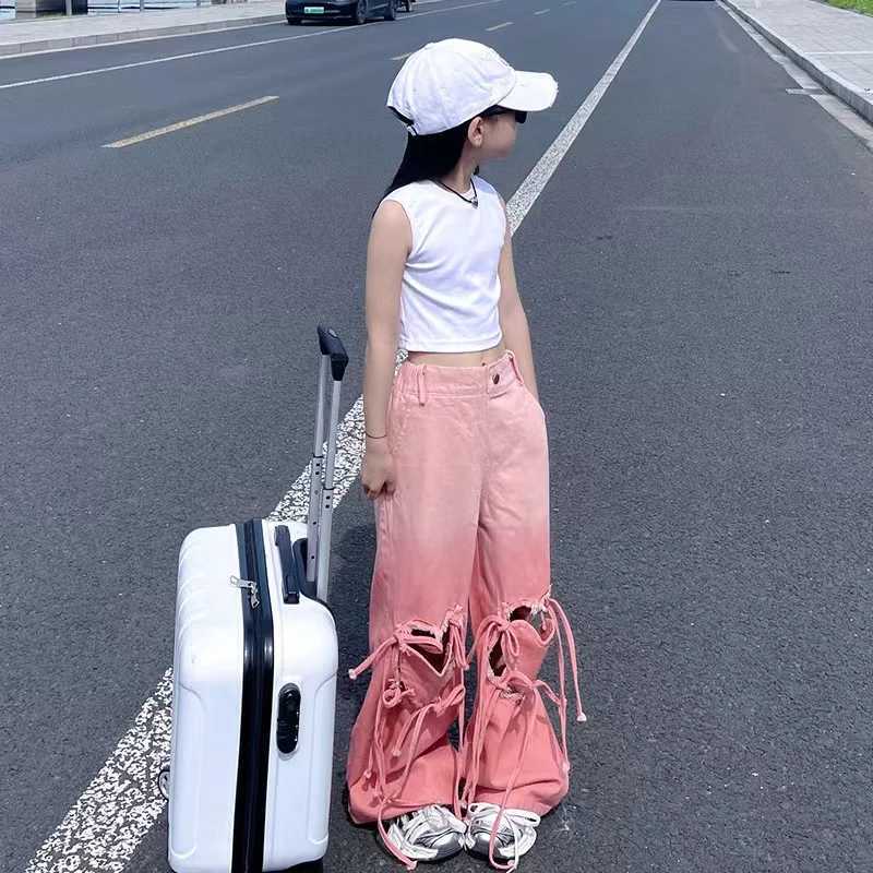 Girl pink jeans Korean heart-shaped hollow bag bandage denim Trouser childrens wide jeans retro fashion version clothingT250326