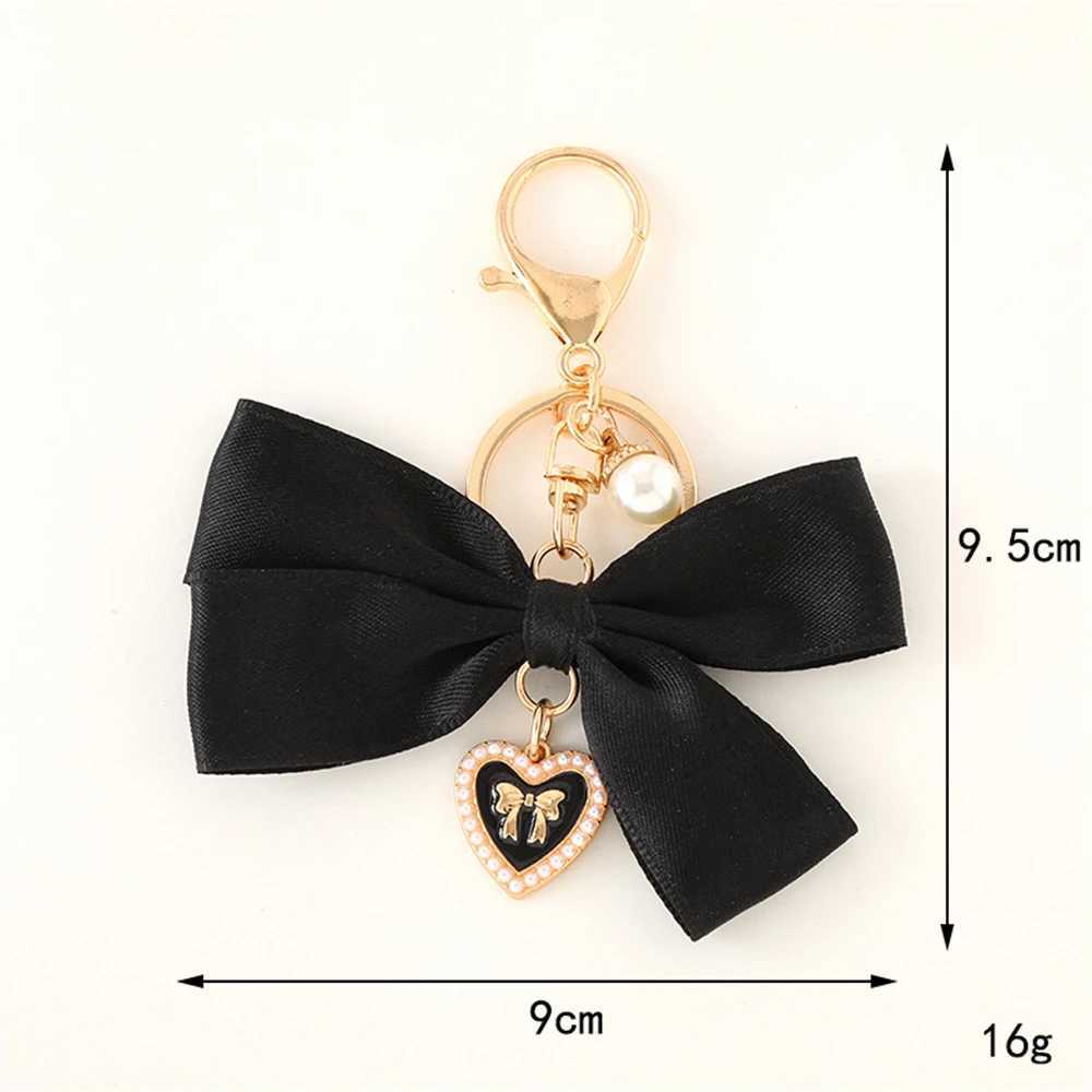 New fabric ribbon bow keychain fashionable heart-shaped pearl pendant womens customized keychain hanging rope car keychain bag accessoriesXJ250319