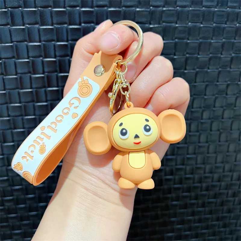 Cheburashkas monkey keychain cartoon animal doll car keychain backpack pendant decoration childrens education Christmas giftXJ250319