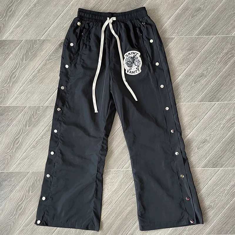 Men's Pants Harajuku style personalized button SAINT VANITY sports pants windproof jacket real photo classic black windproof sportswear J250318