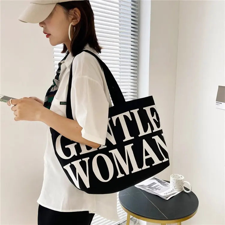 Womens large capacity shoulder bag shopping bag fashion personality letter travel canvas handbag womens handbag 250318