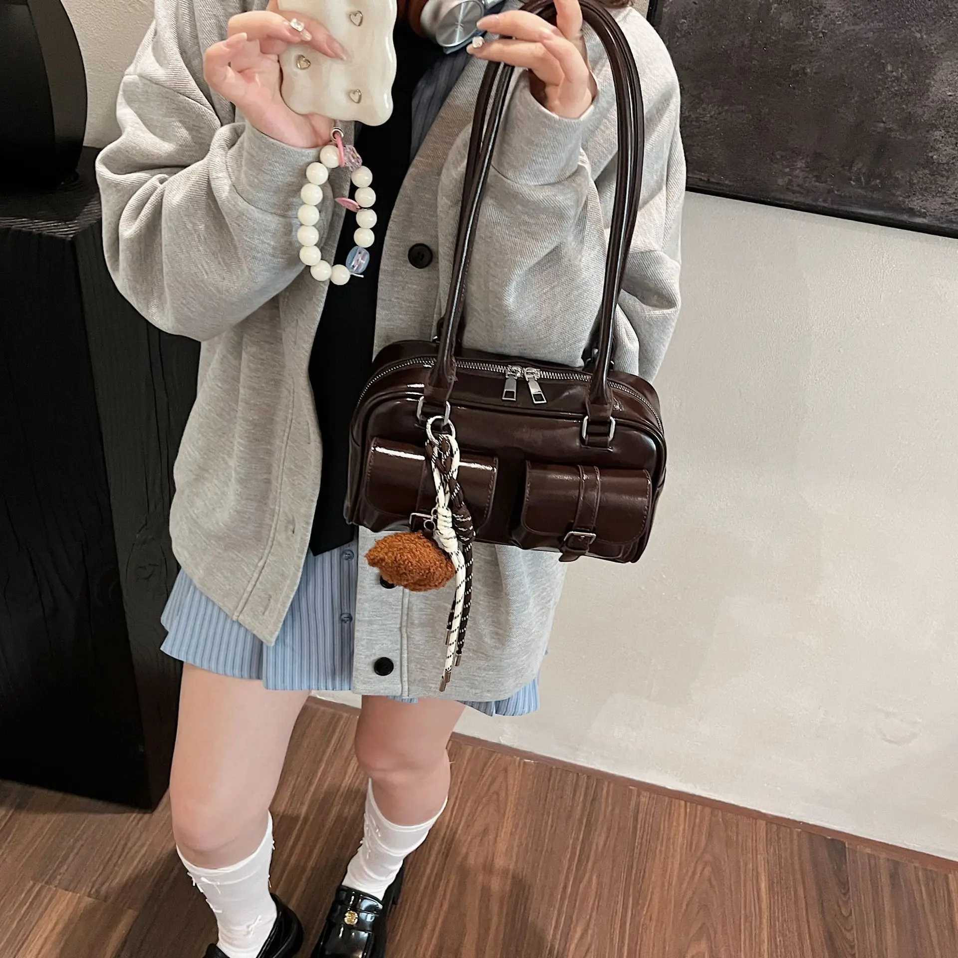 25 year new womens bag pillow bag womens lightweight luxury niche Pu high-end feeling handheld bill of lading shoulder bag S Y250320