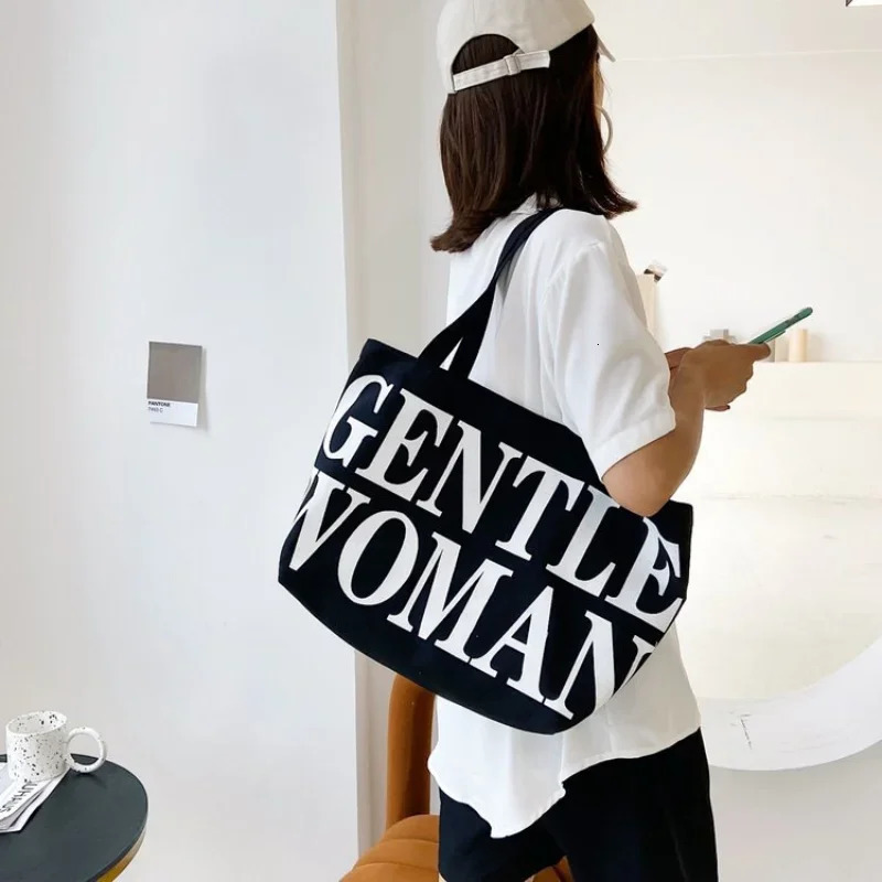 Womens large capacity shoulder bag shopping bag fashion personality letter travel canvas handbag womens handbag 250318