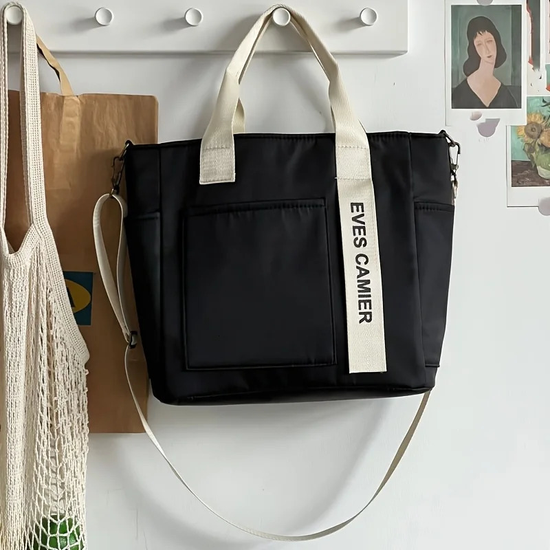 EVEs camera multi pocket handbag with adjustable shoulder strap zipper closure perfect for school work travel or daily use 250320