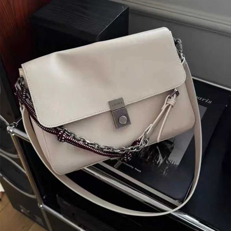 Newly designed womens cross shaped bag fashionable rope shoulder strap womens shoulder bag Y250320
