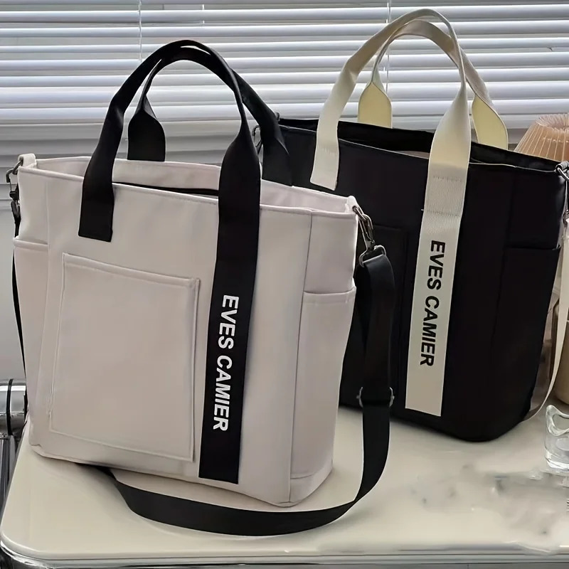 EVEs camera multi pocket handbag with adjustable shoulder strap zipper closure perfect for school work travel or daily use 250320