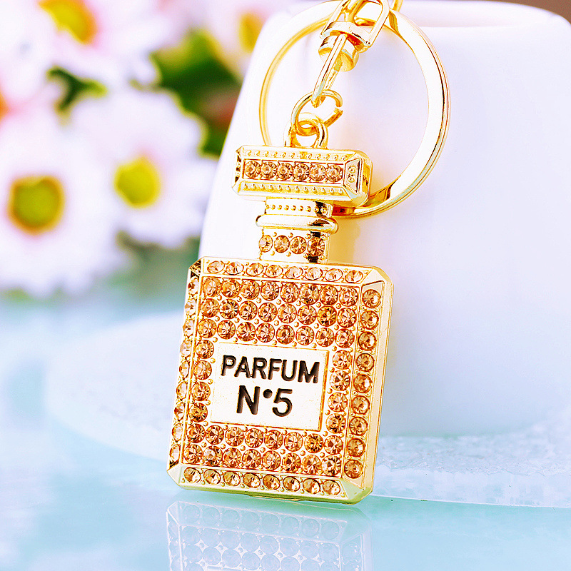 Chic Women's Keychain Featuring Diamond-Covered Perfume Bottle Design Stylish Metal Bag Accent