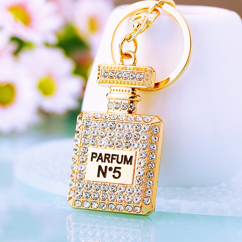 Chic Women's Keychain Featuring Diamond-Covered Perfume Bottle Design Stylish Metal Bag Accent