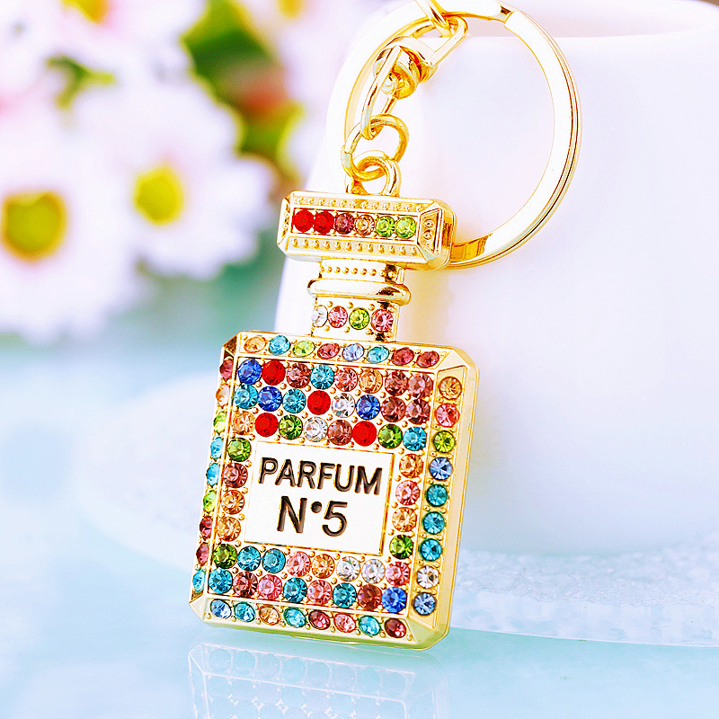 Chic Women's Keychain Featuring Diamond-Covered Perfume Bottle Design Stylish Metal Bag Accent