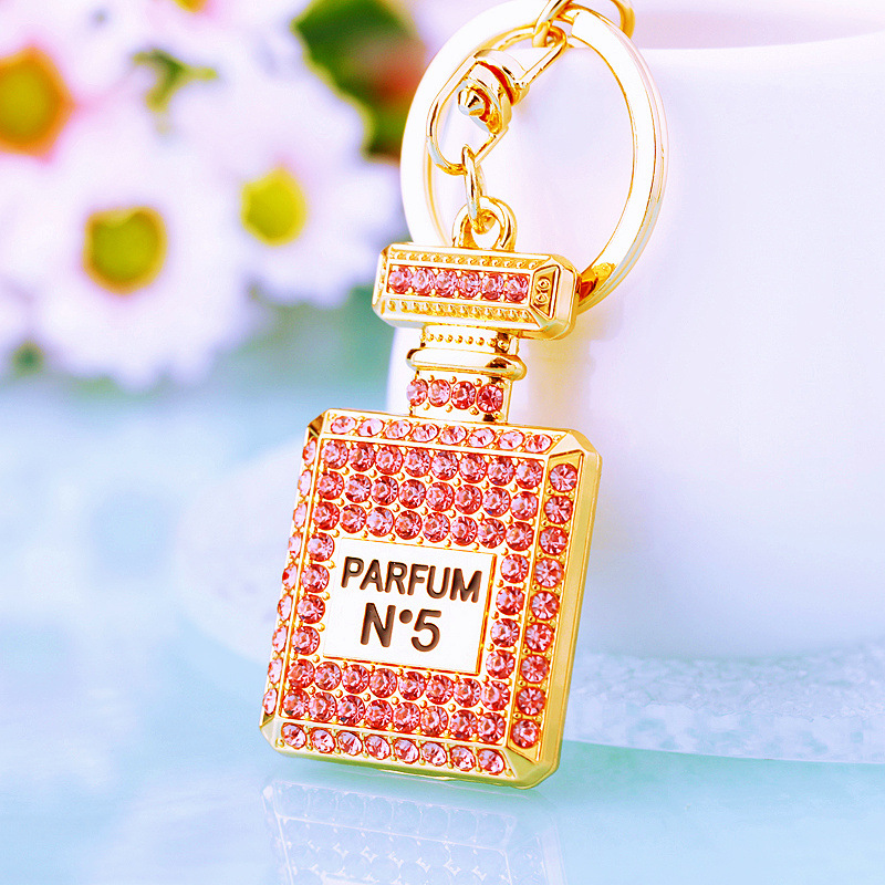 Chic Women's Keychain Featuring Diamond-Covered Perfume Bottle Design Stylish Metal Bag Accent
