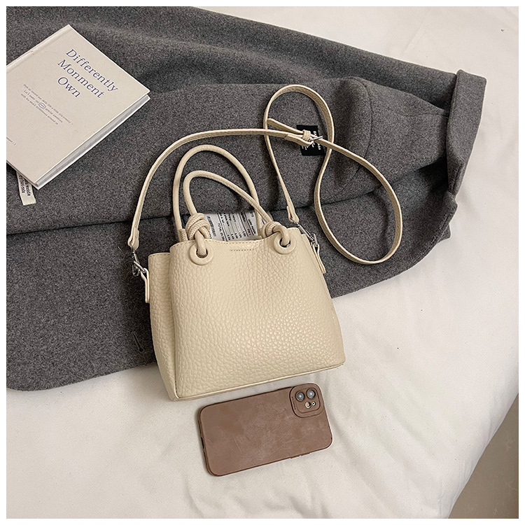 2025S Fashion Designer Litchi Patterned Vegetable Basket Crossbody New Hand Held Bucket Women S Bag High End And Versatile Commuting Shoulder Bag