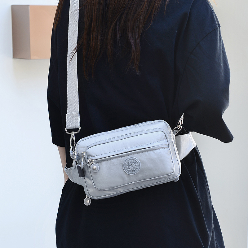 2025S Fashion Designer Ladies With Waist Buckle Nylon Anti Splash Fashion Shoulder Crossbody Solid Color Work Travel Bag
