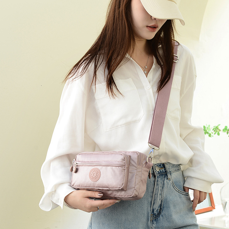 2025S Fashion Designer Ladies With Waist Buckle Nylon Anti Splash Fashion Shoulder Crossbody Solid Color Work Travel Bag