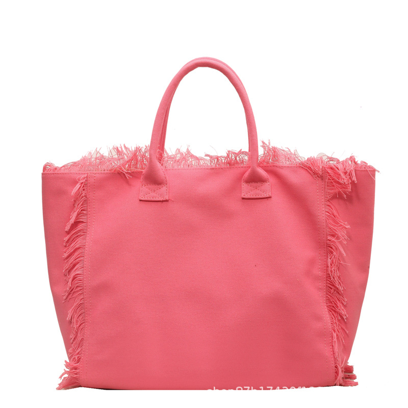 Letter tassel canvas bag large capacity bag women's new solid color commuter shoulder Tote bag 2025s hot