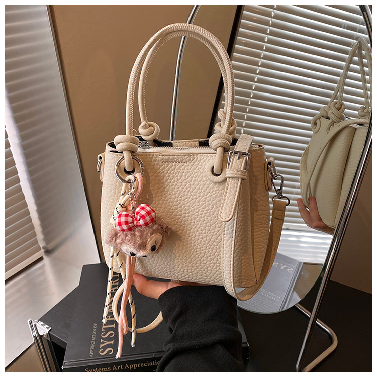 2025S Fashion Designer Litchi Patterned Vegetable Basket Crossbody New Hand Held Bucket Women S Bag High End And Versatile Commuting Shoulder Bag