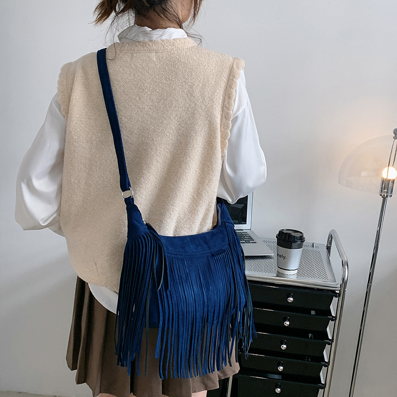 New American Bohemian fringe women's bag imitation deerskin vintage saddle bag Fashion Spice crossbody bag