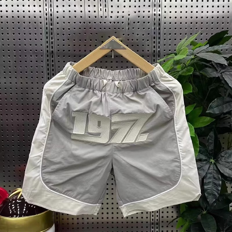2025S Fashion Designer Summer New Trendy Brand Fashionable Casual Shorts Men S Patchwork Five Quarter Embroidered Loose Outdoor Sports Beach Pants