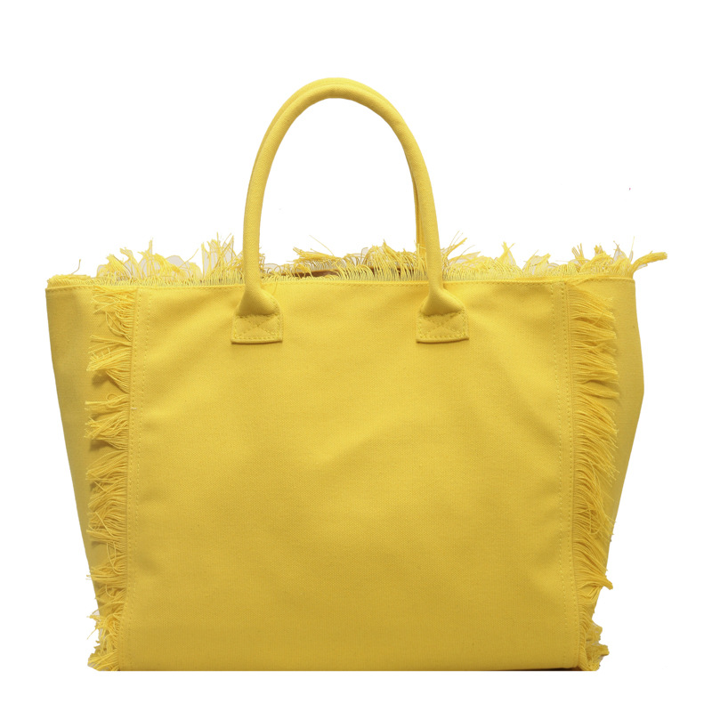 Letter tassel canvas bag large capacity bag women's new solid color commuter shoulder Tote bag 2025s hot