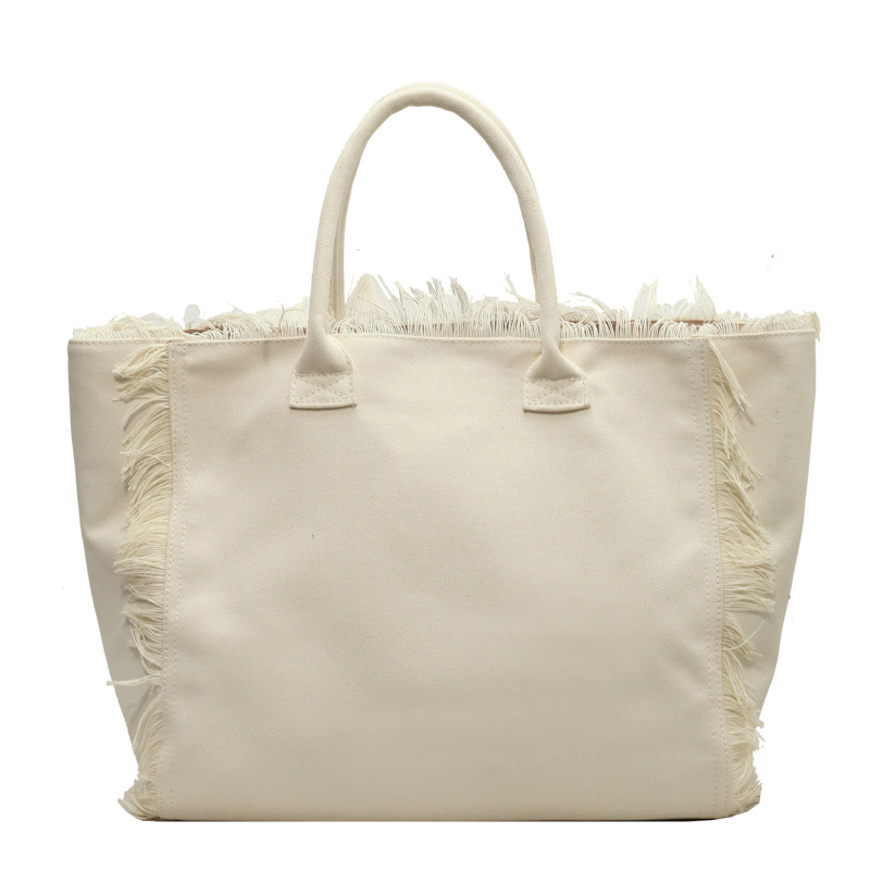 Letter tassel canvas bag large capacity bag women's new solid color commuter shoulder Tote bag 2025s hot