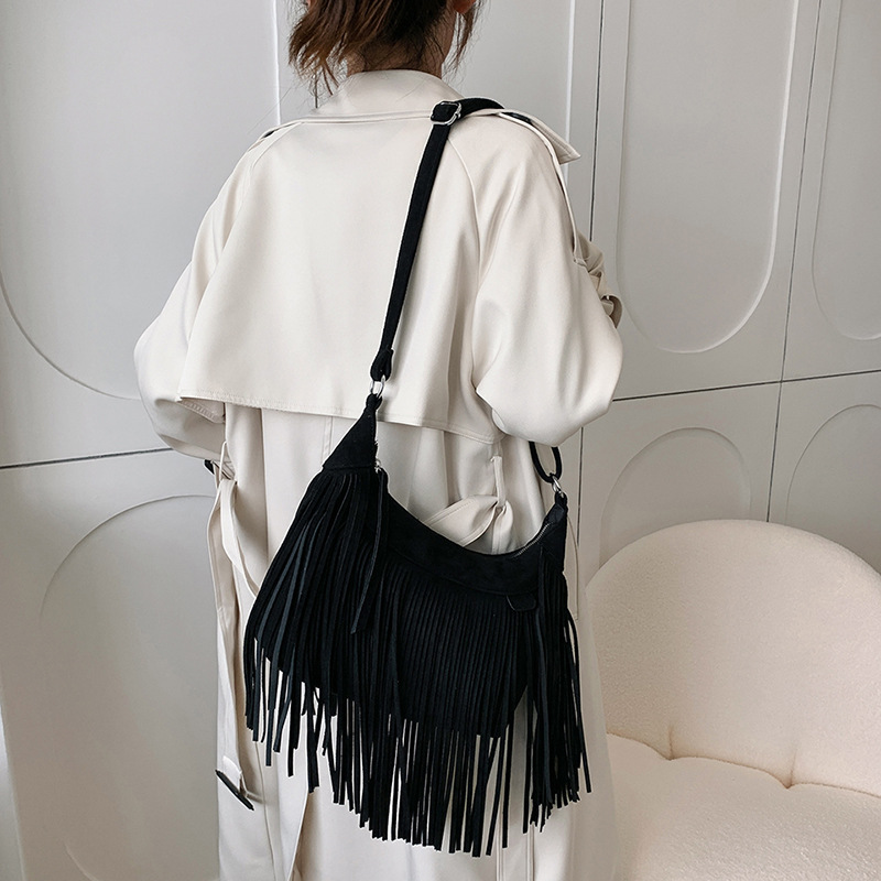New American Bohemian fringe women's bag imitation deerskin vintage saddle bag Fashion Spice crossbody bag