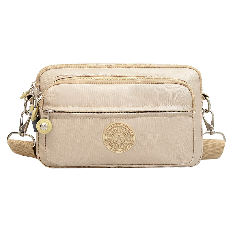 2025S Fashion Designer Ladies With Waist Buckle Nylon Anti Splash Fashion Shoulder Crossbody Solid Color Work Travel Bag
