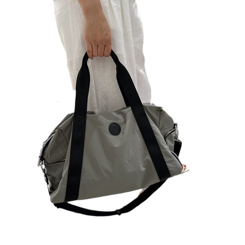 2025S Fashion Designer Travel Women S Short Distance Large Capacity Luggage Fitness Bag Men S Fashionable Handbag Casual Commuting Crossbody Storage
