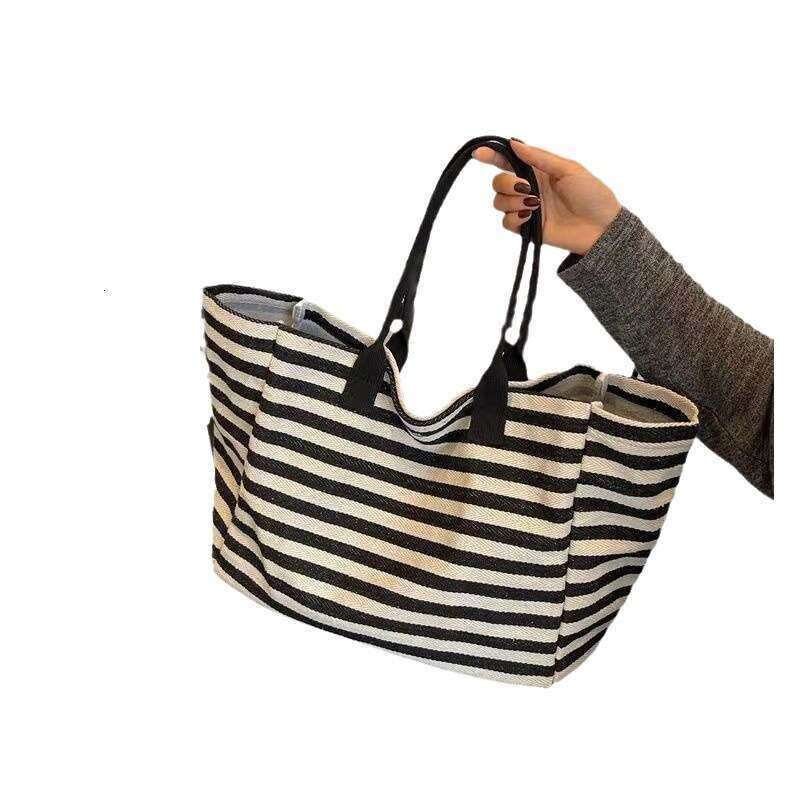 2025S Designer S New Model Commuting Canvas Women S Large Capacity Bag New Striped Single Shoulder Mommy Tote Bag