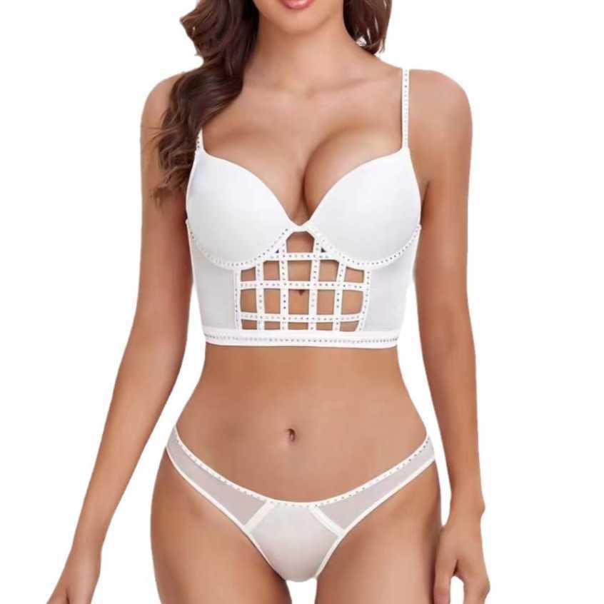 Fashionable and sexy hollowed out fishbone suit with thin top, thick bottom, and top support, gathered together with bra nails and diamond smooth surf