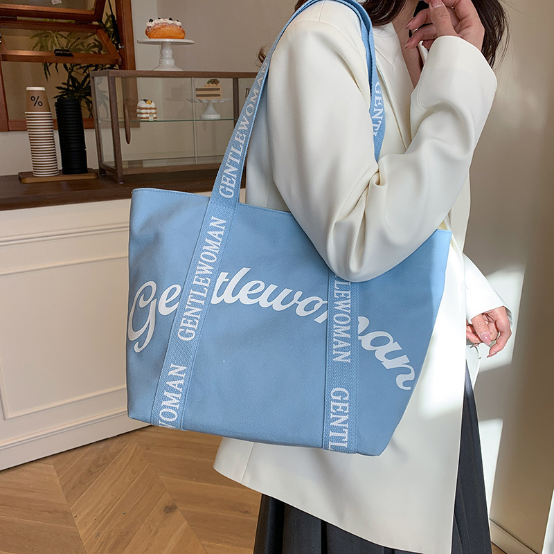 2025S Fashion Designer Gentle Woman Large Capacity Commuter Mommy Tote New Letter Strap Handheld Shoulder Bag