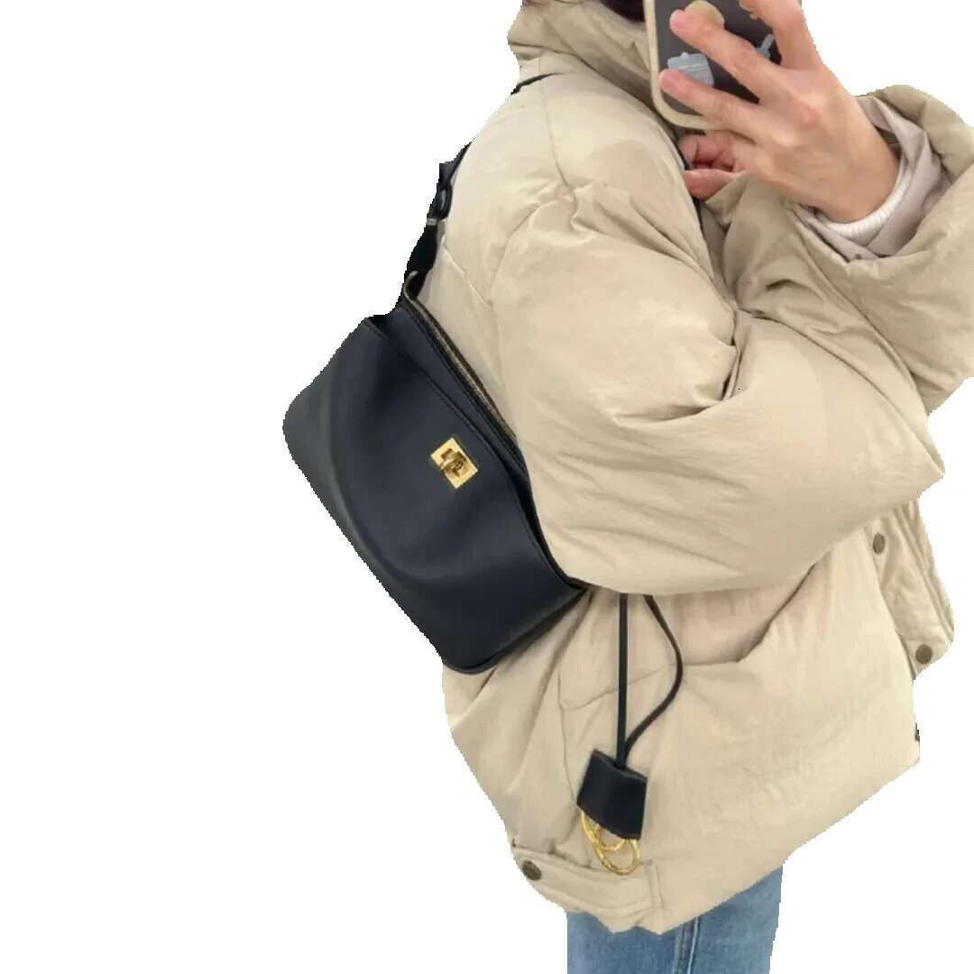 2024 New Cowhide B Home Lock Underarm Premium Leather Handheld Crossbody Women's Bag Simple Commuter The Single Shoulder Bag