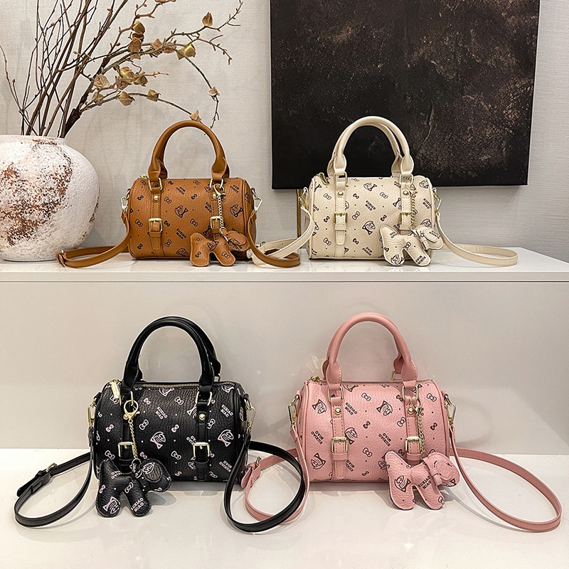 Free shipping 2025 new designer bag, fashionable commuting dog decoration pillow bag, hand-held single shoulder diagonal cross bag