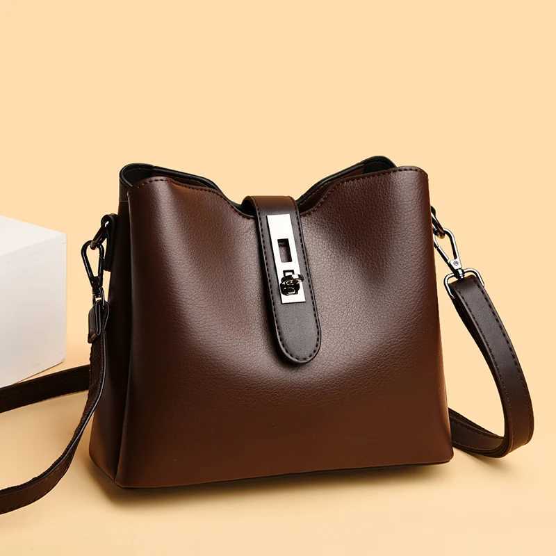 High quality oil wax leather bucket bag 2024 womens handbag large capacity shoulder bag fashionable lock grip cross body bag handbag Z250324