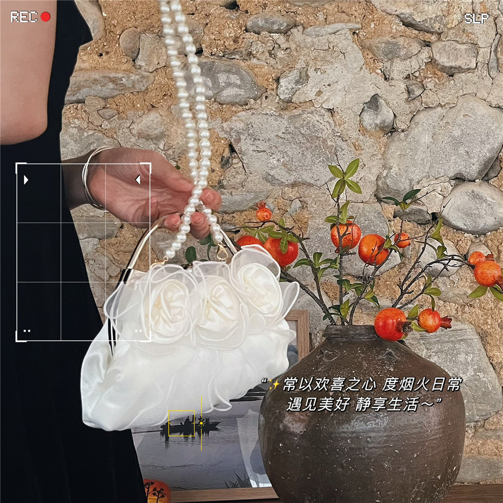 Designer 2025S pearl flower fairy mesh handbag women gentle style shoulder crossbody sweet and fresh small bag