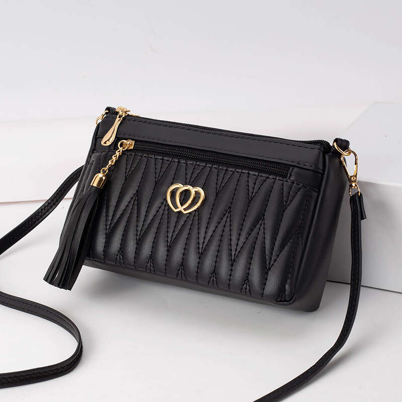Mom's middle-aged high-end small mini crossbody bag, women's niche tassel soft leather mailman's bag