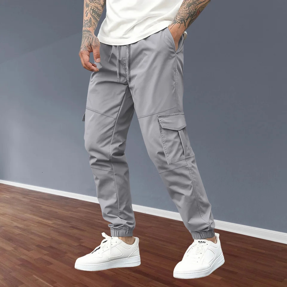 mens casual full set youthful and fashionable integrated multi pocket sports pants solid color classic comfortable combat pants 250321
