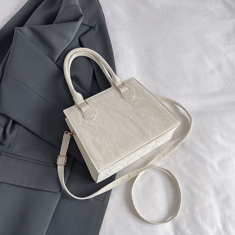 Free shipping Fashion niche design folding hand bag small square retro fashion texture single shoulder crossbody bag