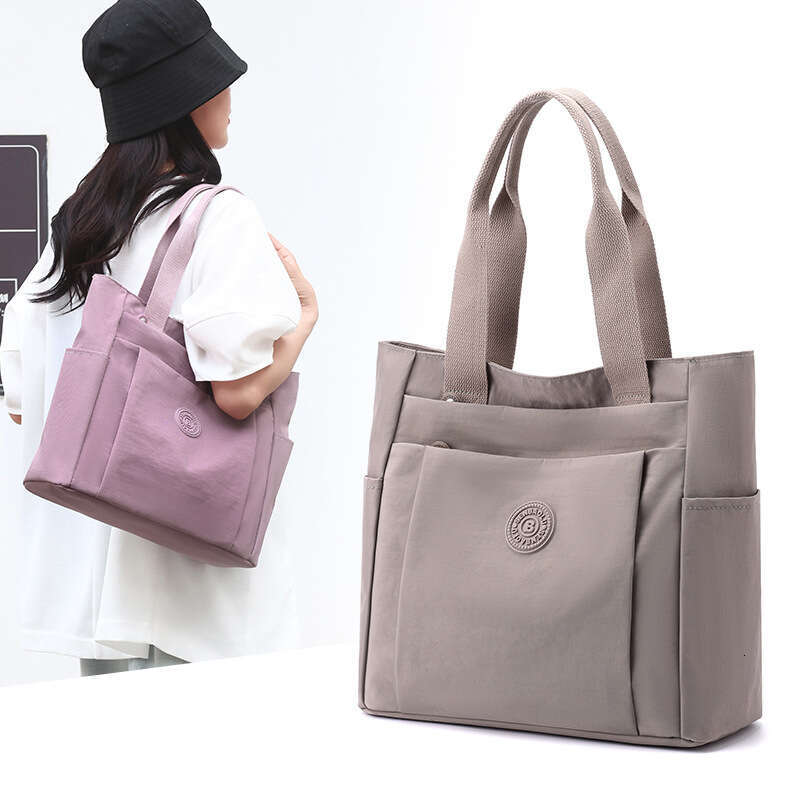 d1 Casual women's handbag style 2024 summer new large capacity casual solid color nylon cloth single shoulder hand-held mother bag
