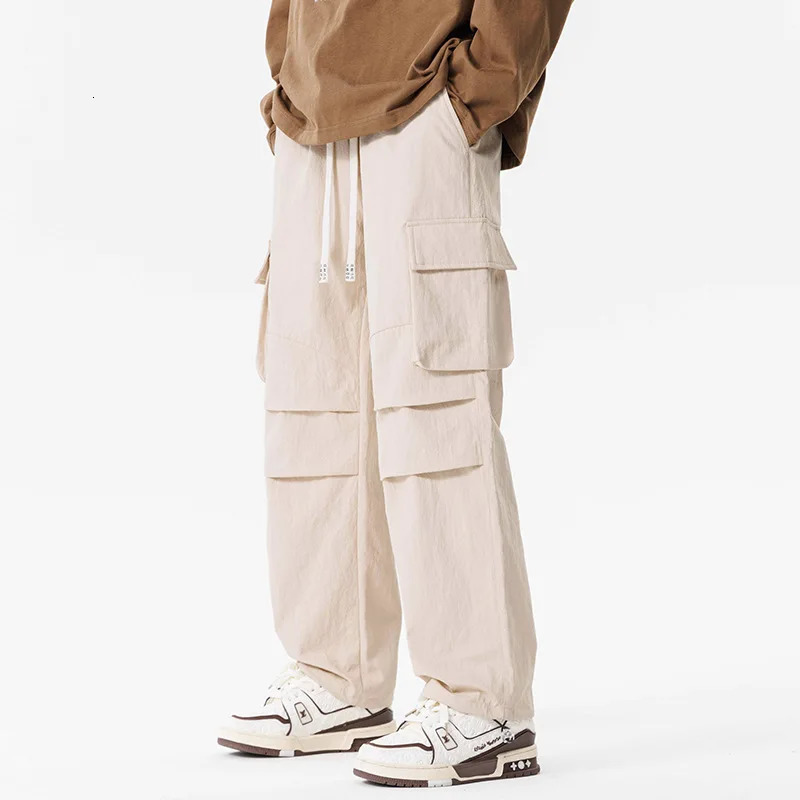 Work pants mens umbrella style assault pants outdoor waterproof loose size straight casual mens work clothes 250321