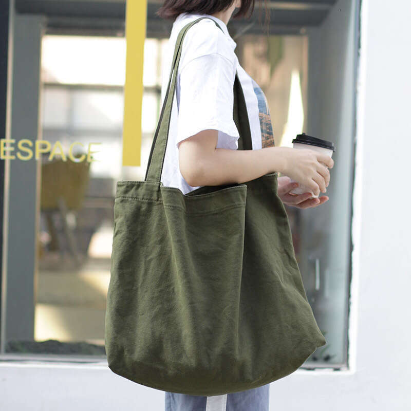 Korean version simple and large capacity canvas net red, lightweight solid color single shoulder women's casual shopping bag, handbag